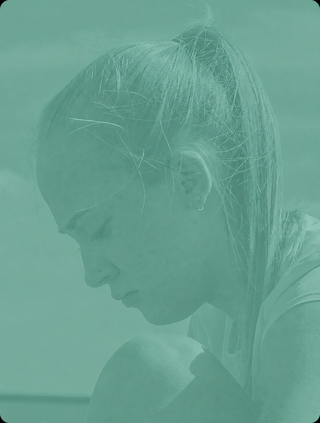 Bebe concentrating during filming for the Little Acorns Fostering campaign, shown with a green campaign overlay.